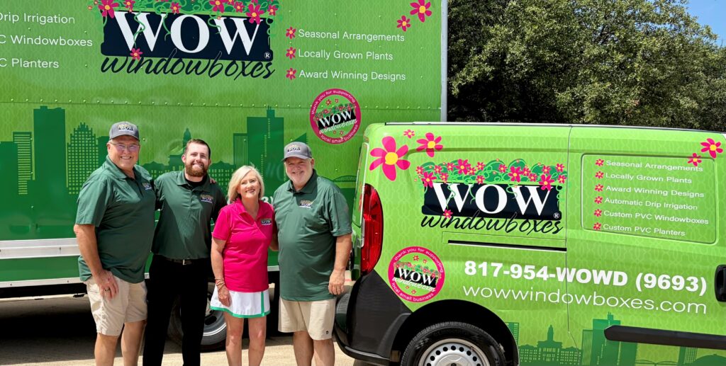 2026-07-02-team-crop wowwindowboxes Fort Worth Team posing with colorful trucks